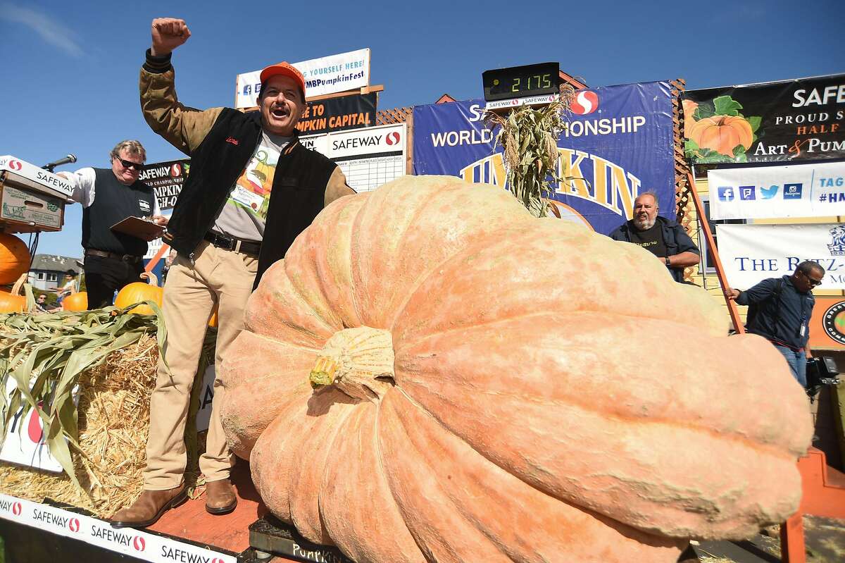 Leonardo Urena from Napa celebrates after his Atlantic Giant pumpkin weighed in at 2175 pounds, a new California record, to win the Safeway World Championship Pumpkin Weigh-off on October 14, 2019 in Half Moon Bay, CA. "I've really enjoyed growing it," said Urena, who has been growing competitive giant pumpkins, gourds, watermelons, beets and tomatoes for 20 years. "It's one of the most aggressive plants I've grown."