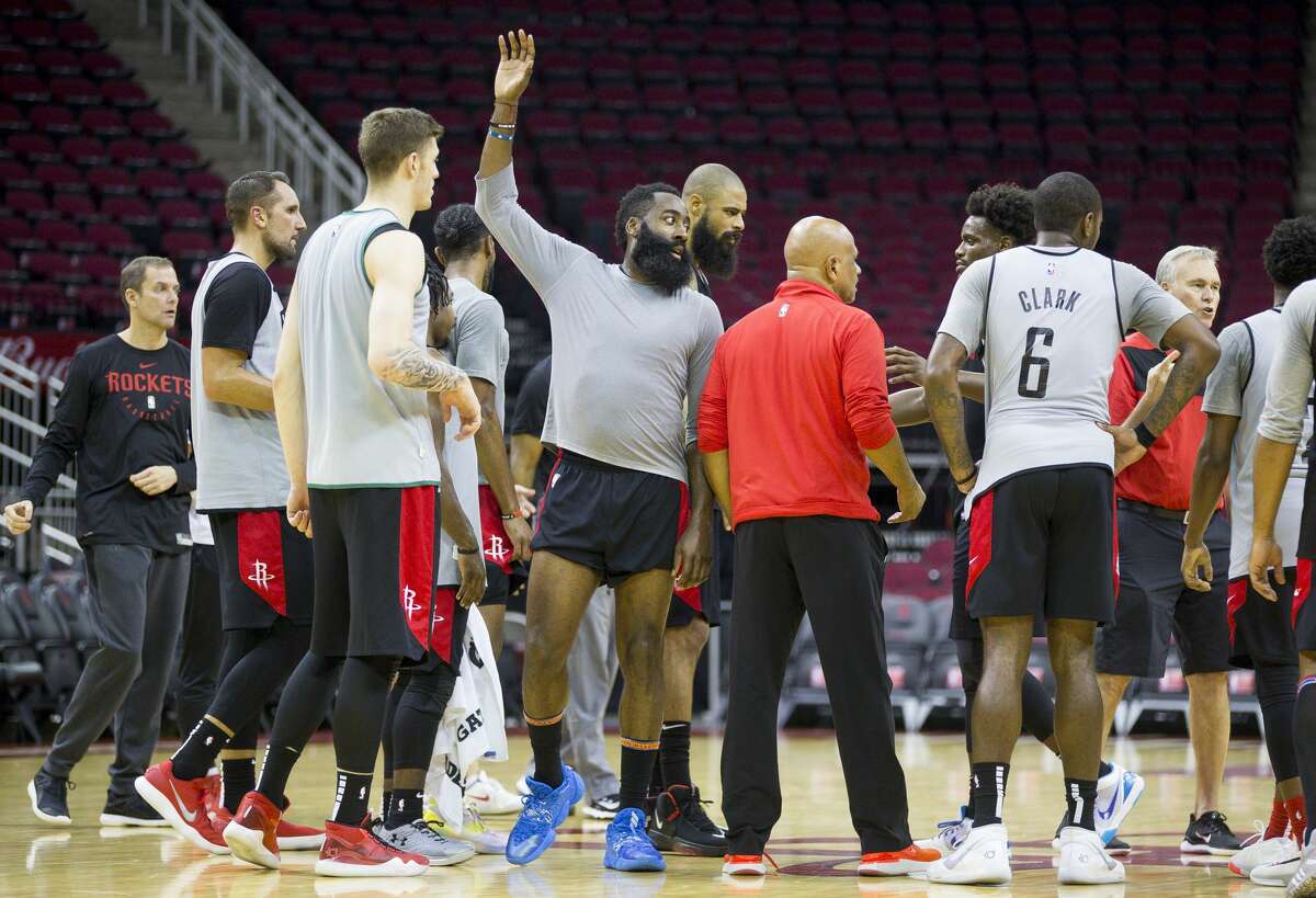 Houston Rockets guard James Harden high fives teammates during a Houston Rockets practice open to fans at Toyota Center in Houston, Monday, Oct. 14, 2019.