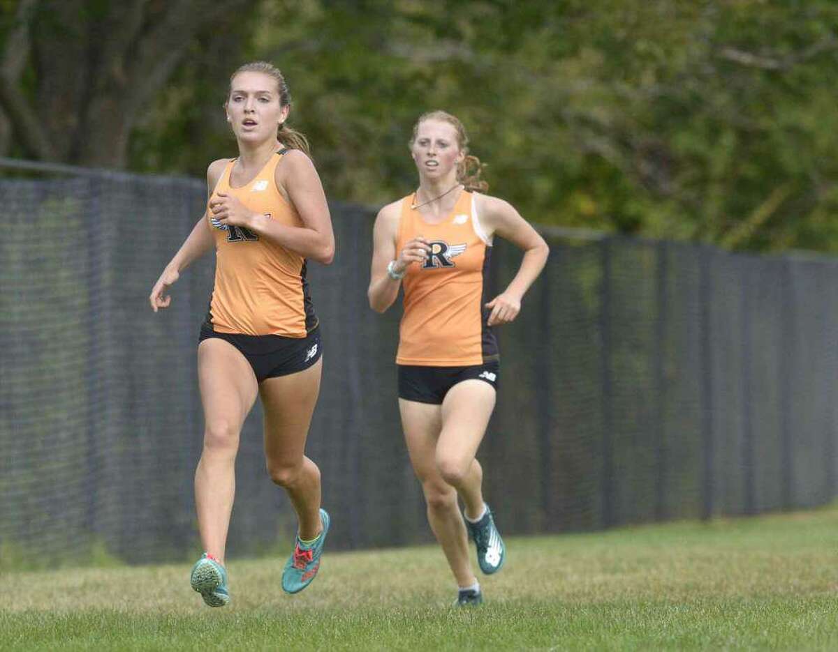 Senior Tess Pisanelli (left) and sophomore Katie Rector have been the top-two runners for the unbeaten Ridgefield girls cross country team.