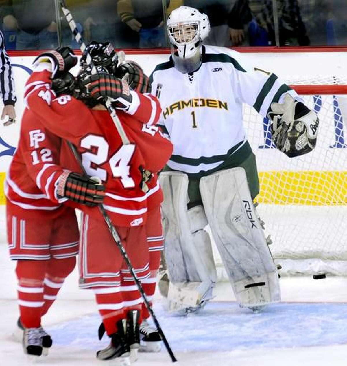 Fairfield Prep players celebrates their third goal of the night as Hamden goalie Ryan Amarone can only look on. Top-ranked Prep beat No. 2 Hamden in Tuesday’s game at the TD Bank Sports Center. (Photo by Melanie Stengel/ New Haven Register)