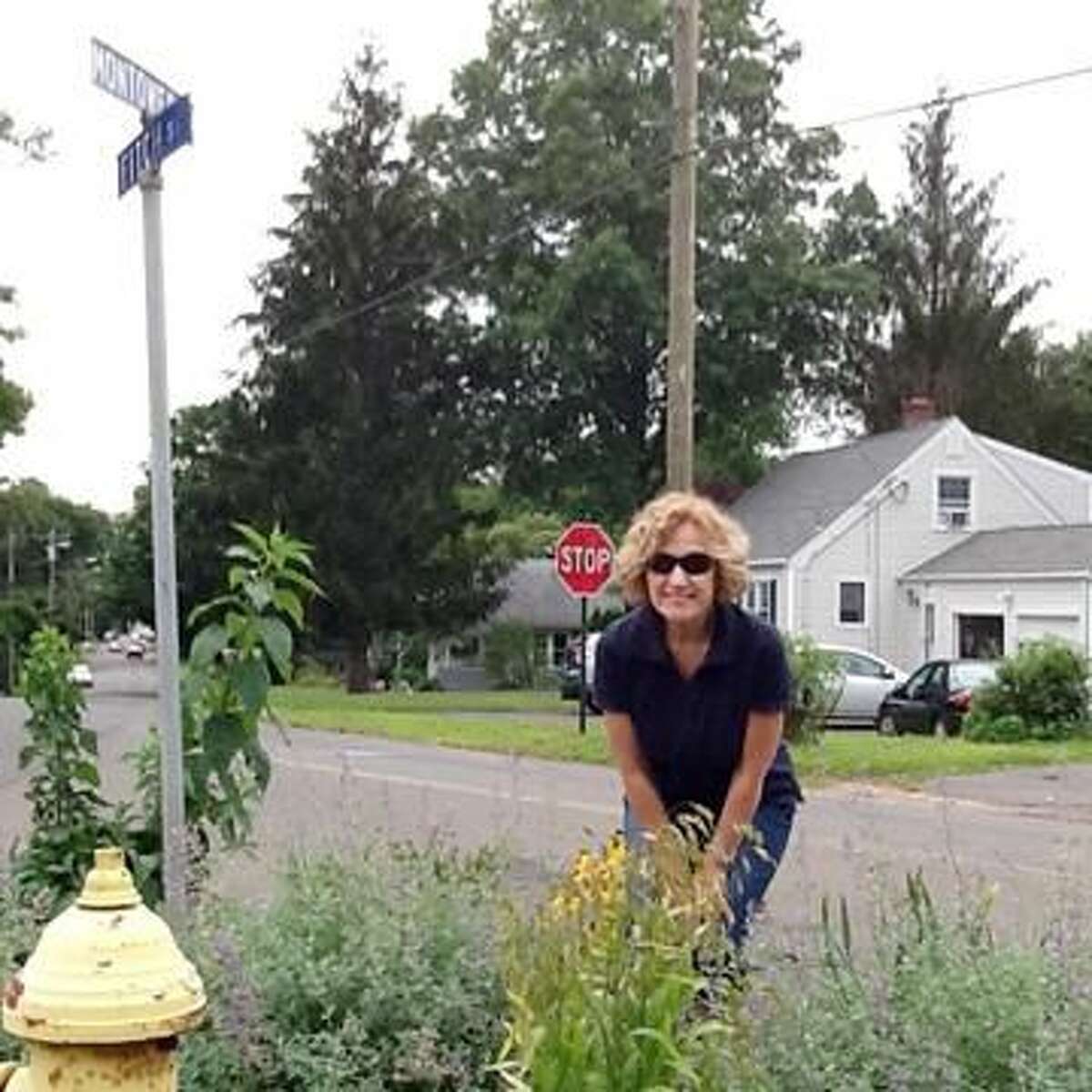 Submitted Photo Marge Quinn with her garden on the corner of Montowese and Fitch streets.