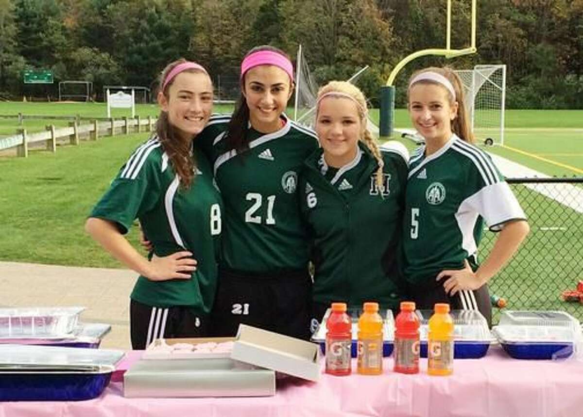 Submitted Photo Hamden Hall Country Day School Girls’ Varsity Soccer captains, from left, Maya Harlan of Hamden, Bianca Tomassini of North Branford, Olivia D’Anna of Milford and Doria Weiss of Orange, raised more than $500 for breast cancer on their Senior Day.