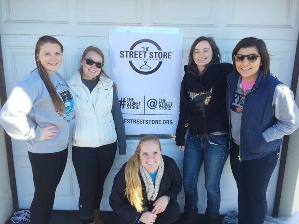 Submitted Photo Quinnipiac University students, from left, Katie Toma, Elaine Brown, Steph Hurd, Ashley Hiep and Camille Bova, took part in the Nov. 15 Street Store to provide free clothing to those in need at St. Ann’s Church in Hamden.
