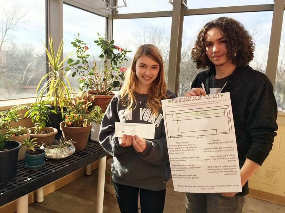 Submitted Photo North Haven High School students, Corrine Myjak and John Gildart, designed an irrigation system funded by The North Haven Education Foundation Inc.