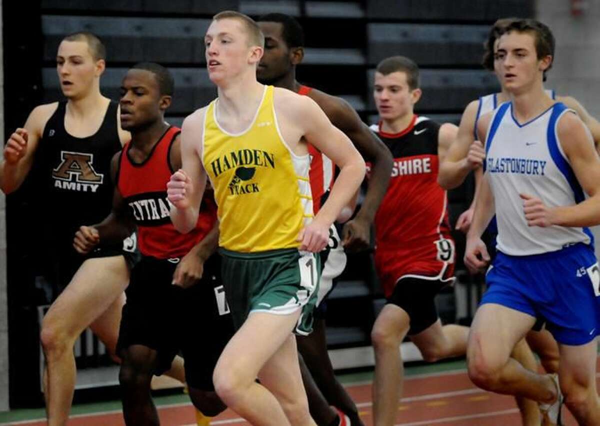 Hamden's Chris FitzSimons wins the 1000 meters to help lead the school to its first Class LL state championship this past Saturday in New Haven. (Photo by Melanie Stengel/ New Haven Register)