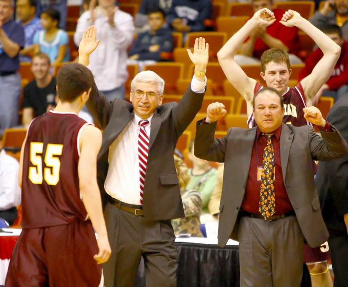 Sheehan coach Joe Gaetano, left, and assistant coach Rich Monocchi raise their arms in celebration as the Titans' 72-61 win over Bloomfield comes to a close and Gaetano's son, Phil Gaetano, exists the game. (Photo by Chase Smith)