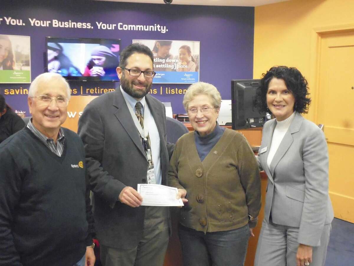 The check was presented to Adam Sendroff, Hamden Community Development Manager (second from left) by Rotarians Lee Campo, Lynn Campo and Liz Abate (at right) Liberty Bank manager.