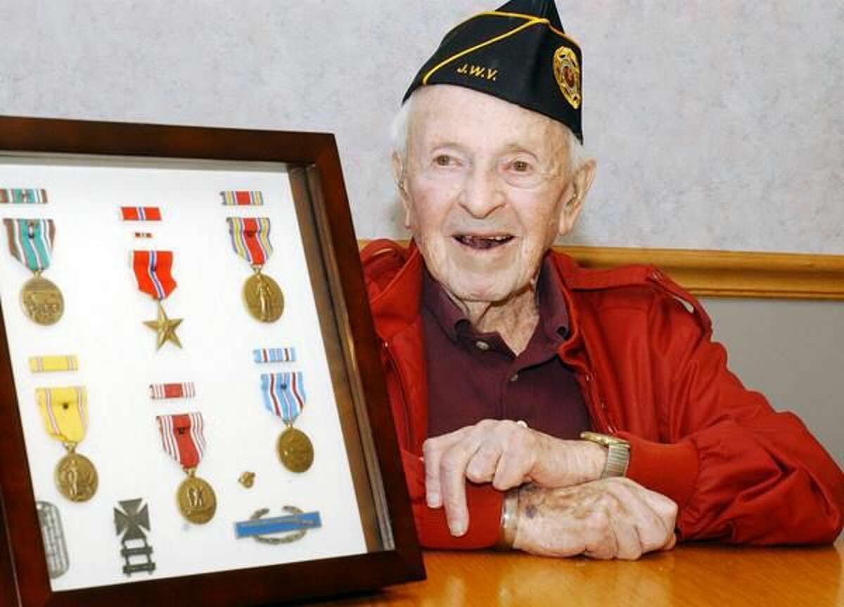 Photos by Mara Lavitt The Jewish War Veterans Post 204 Hamden met for their monthly meeting at Arden House to honor member Joe Lukacs, pictured here with his service medals. Lukacs is turning 100 this month.