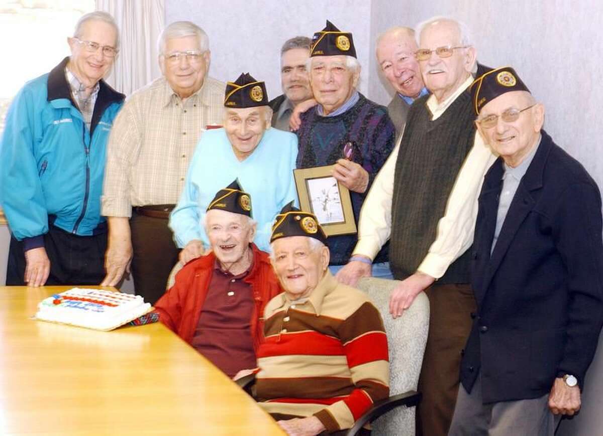 Photo by Mara Lavitt The Jewish War Veterans Post 204 Hamden met for their monthly meeting at Arden House to honor member Joe Lukacs, seated left, who is turning 100 this month.