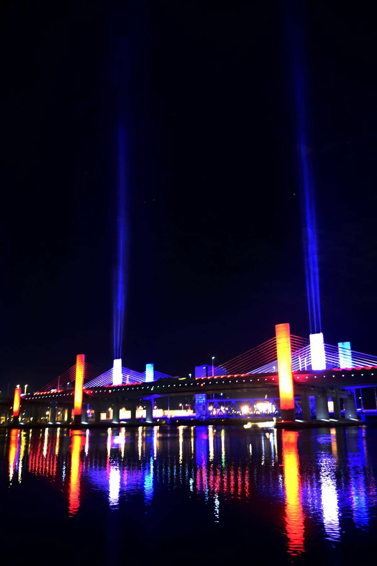 In this file photo, the Pearl Harbor Memorial Bridge in New Haven , also known as the Q Bridge, is photographed from Chapel Street near Mill Street where the Mill River and the Quinnipiac River meet at Criscuolo Park in New Haven. The bridge is lighted for Independence Day.