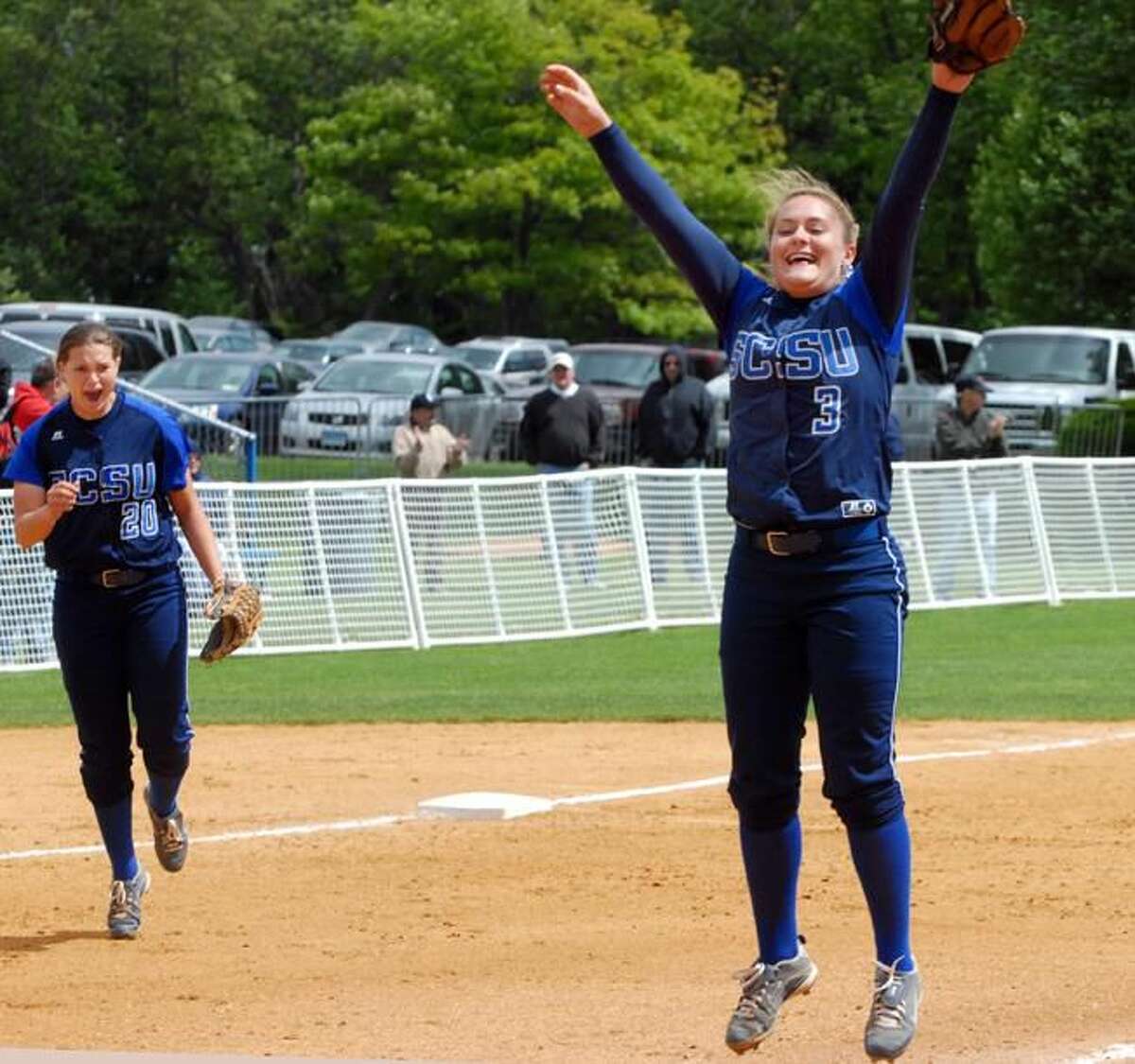 SCSU pitcher Jayme Larson raises her arms in victory after closing out the NE-1o championship. (Photo by Mara Lavitt/ New Haven Register)