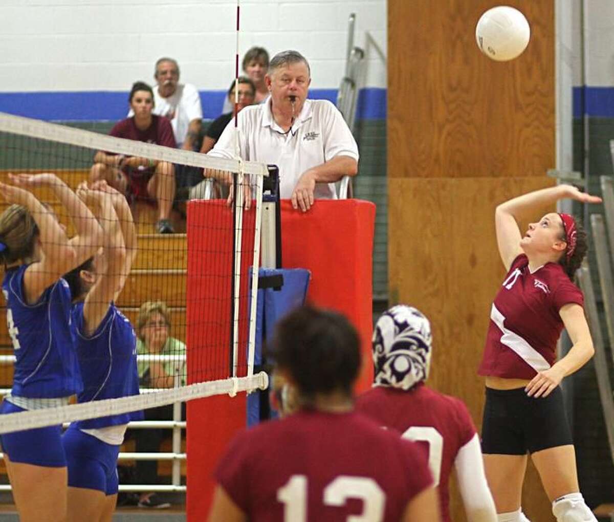 Photo by Russ McCreven North Haven tri-captain Kayla Brown gets set to hit the ball over the net against West Haven.
