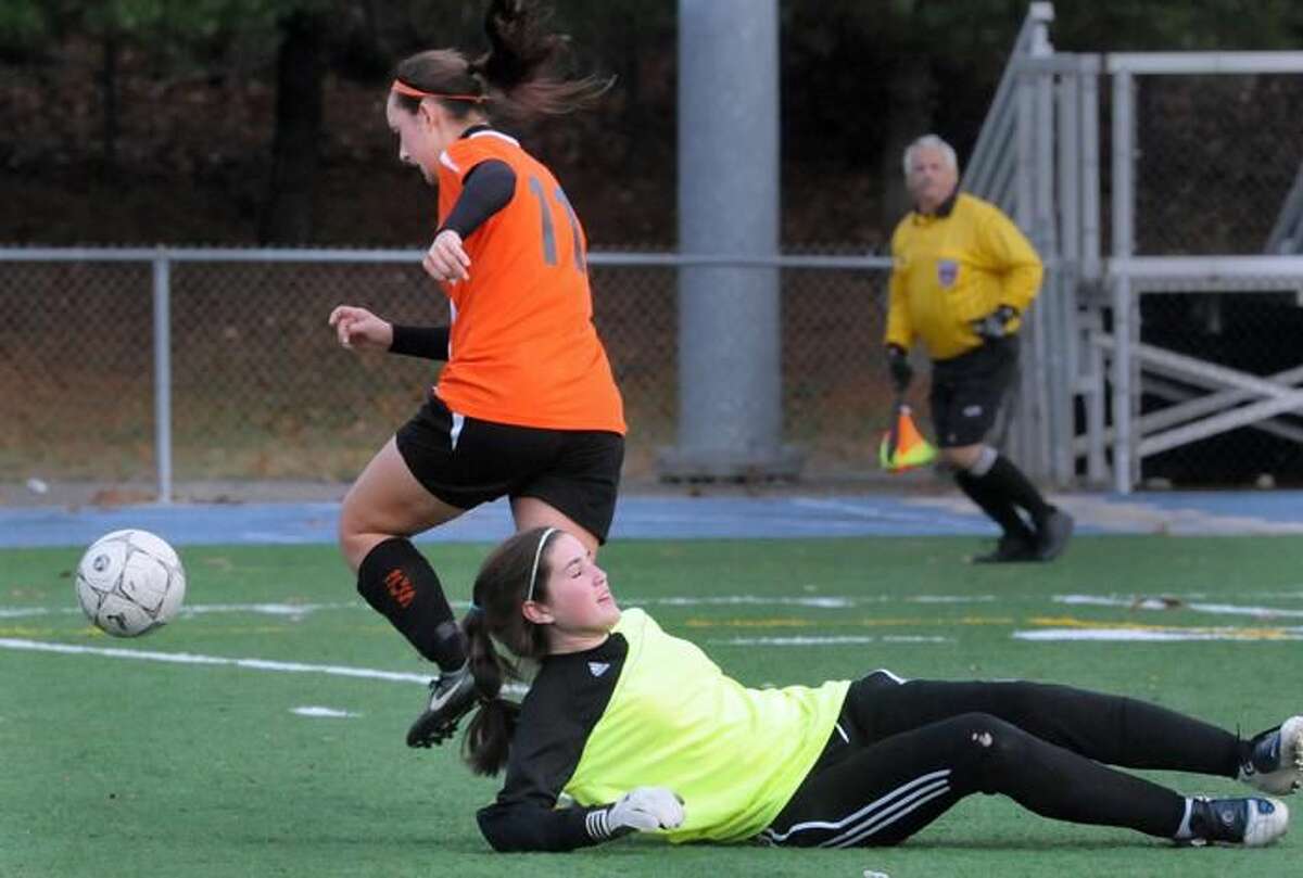 Photo by Melanie Stengel/ Register Shelton's Angie Ferro, left, gets past Hamden goalie Kate Murphy in the first half of Saturday's SCC girls' soccer championship. Ferro didn't score on this possession, but did net the long goal of the game.