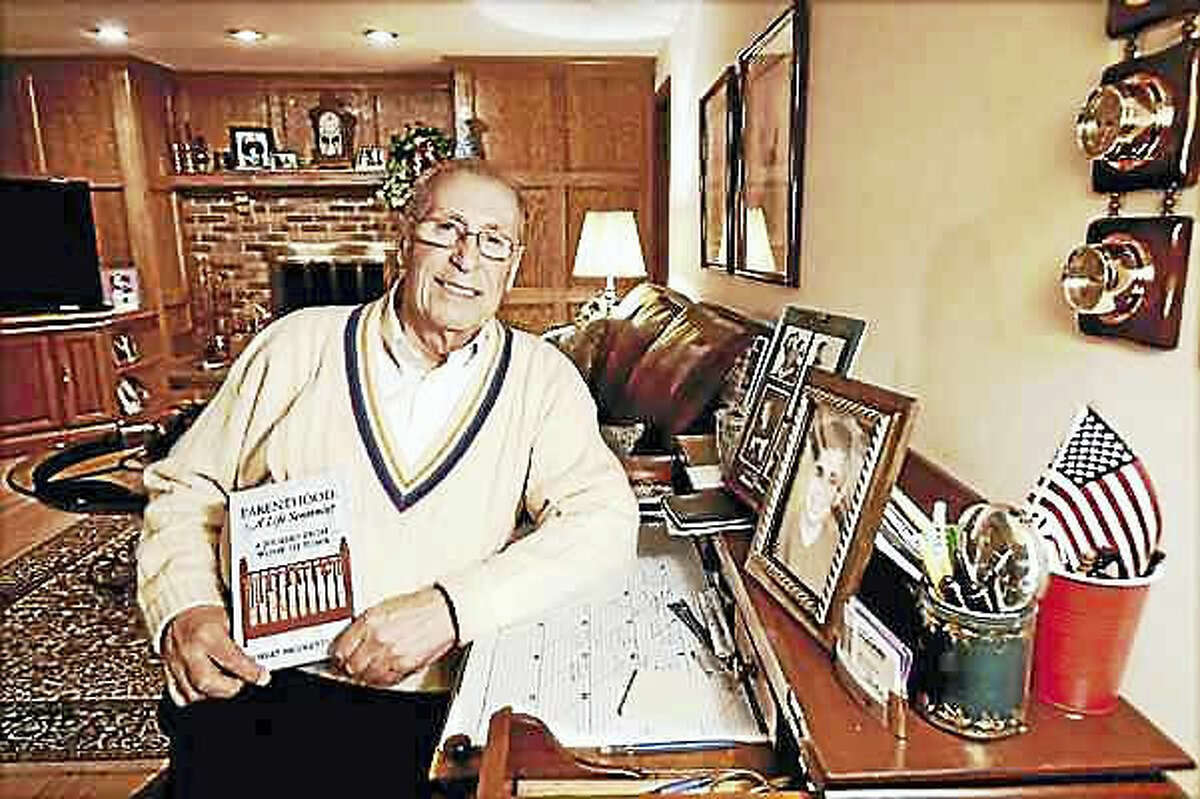 Catherine Avalone — New Haven Register Retired Superintendent of Schools Robert Nicoletti, author of “Parenthood: A Life Sentence - A Journey from Womb to Tomb,” is photographed in his Wallingford home.