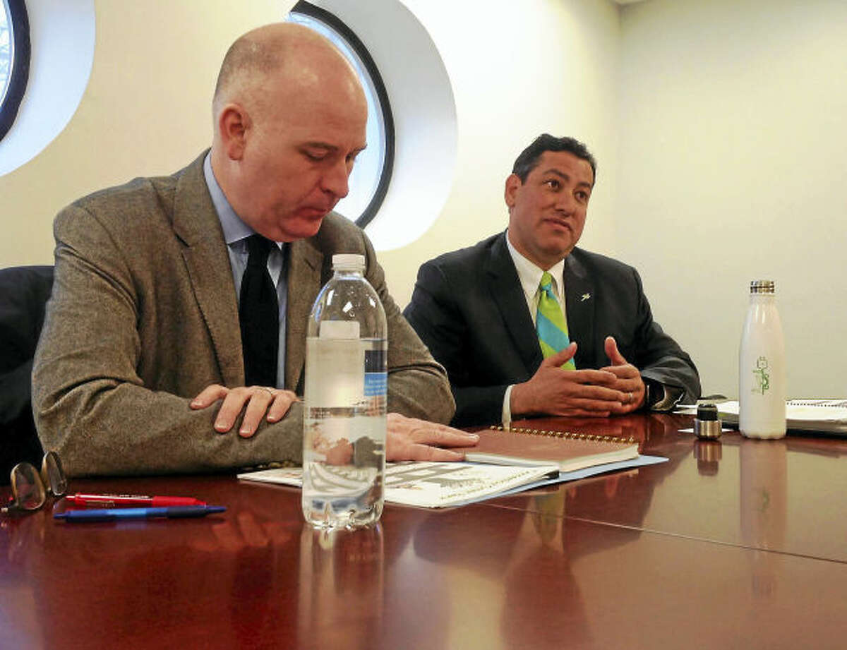 Connecticut Green Bank President and CEO Bryan Garcia, left, and Craig Connolly, Green Bank marketing director, speak to the Register editorial board.