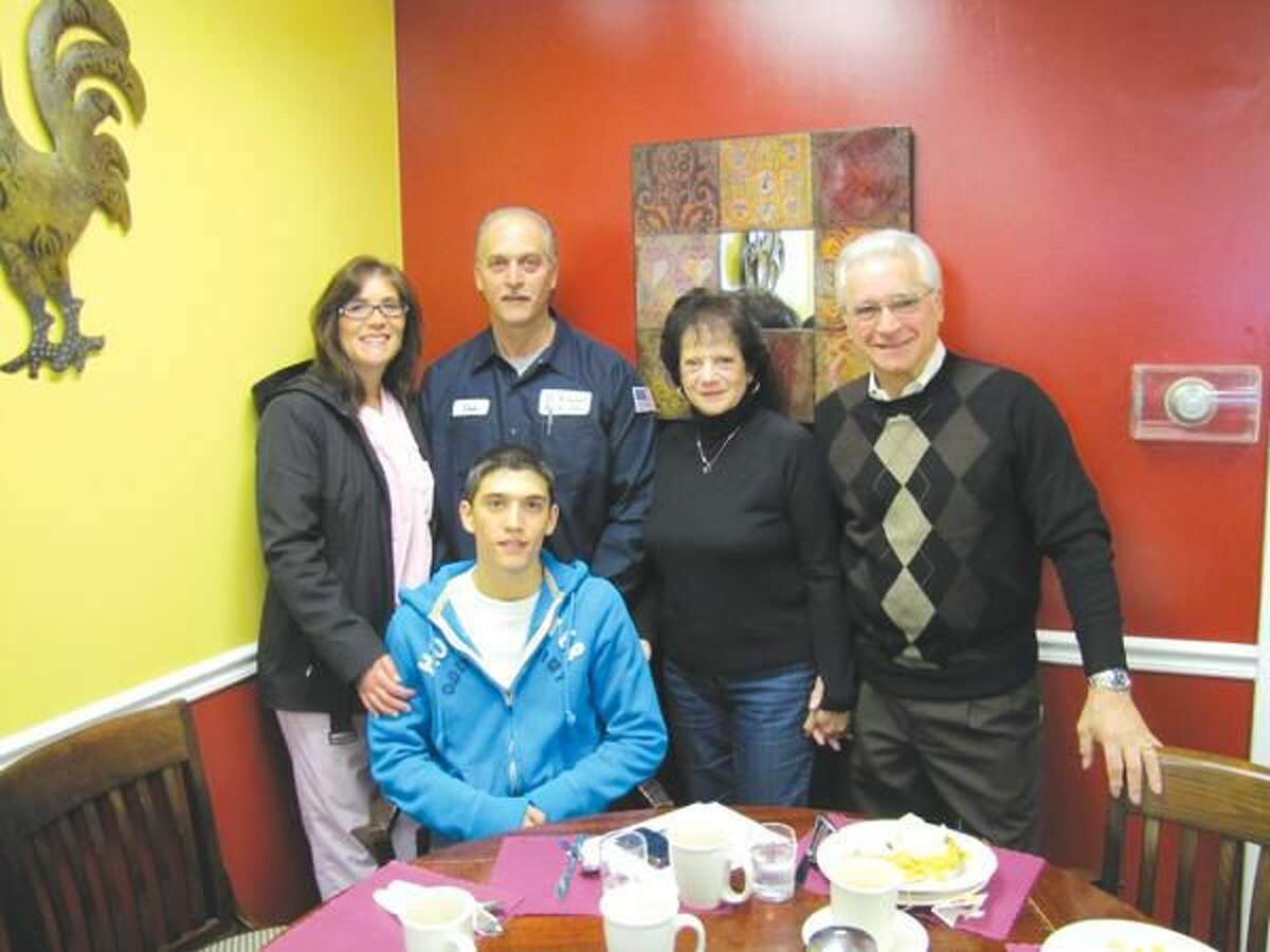 Photo courtesy of David Marchesseault Thomas DeChello, seated, was joined by his parents, left to right, Angela and Donald DeChello, and grandparents, Carolyn and Donald DeChello Sr., at the North Haven Rotary “Unsung Hero Award” ceremony Feb. 8.