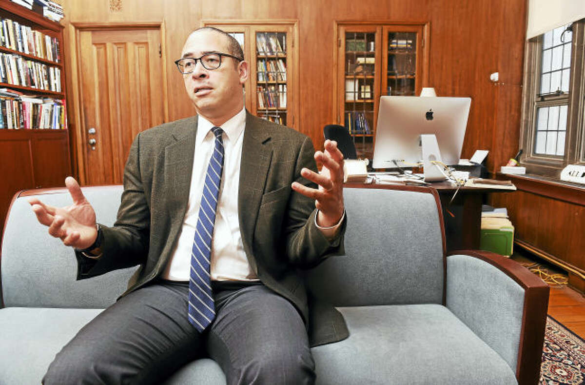 Yale College Dean Jonathan Holloway is photographed in his office at Sheffield-Sterling-Strathcona Hall in New Haven during an interview. He is leaving to take the position of provost at Northwestern University.