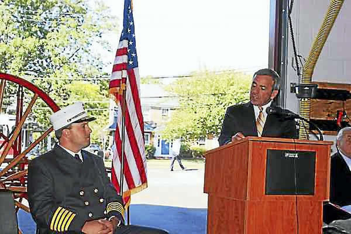 Kate Ramunni — New Haven Register.  North Haven First Selectman Michael Freda, right, speaks at the swearing-in ceremony held at Fire Headquarters for Fire Chief Paul Januszewski, left.