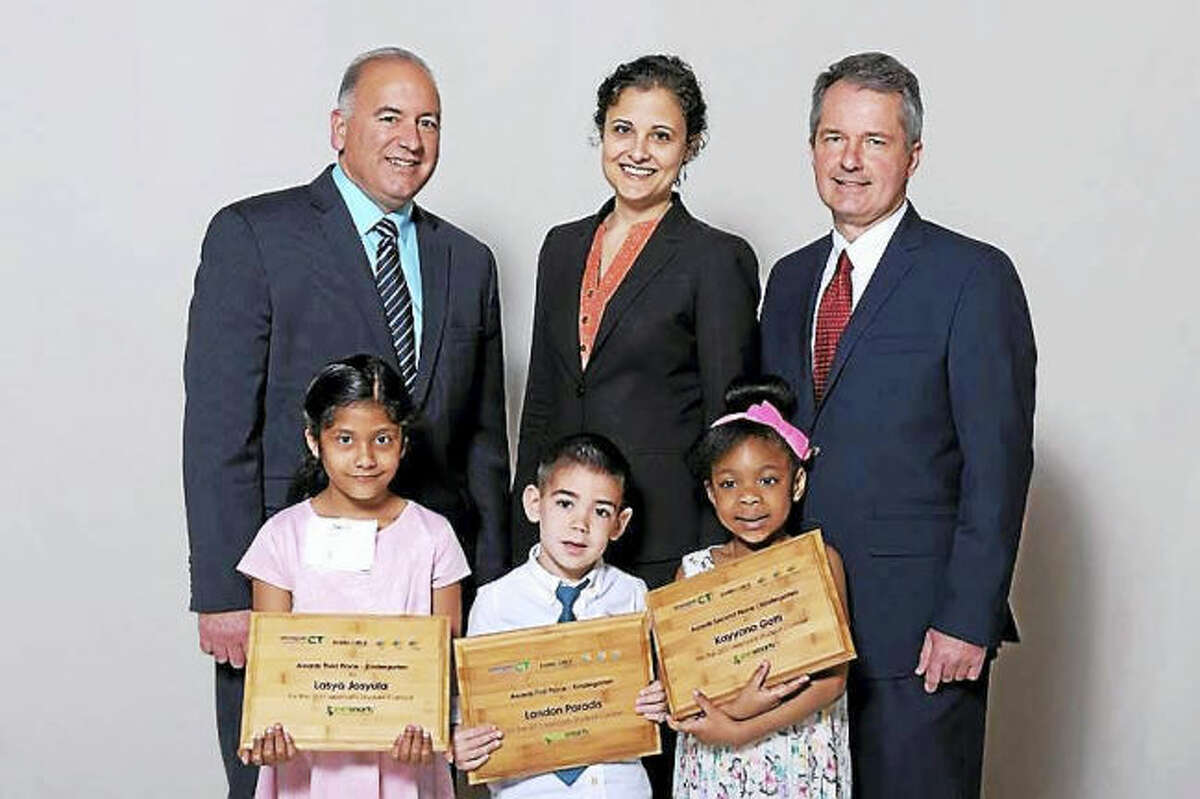 Contributed photo.  Hamden student Lasya Josyula (front, left), pictured with other kindergarten finalists, Ron Araujo, Eversource, Mary Sotos, DEEP Deputy Commissioner, and Pat McDonnell, United Illuminating, received 3rd place for her project at the 13th annual eesmarts Student Contest award ceremony held on June 2 at the State Capitol.