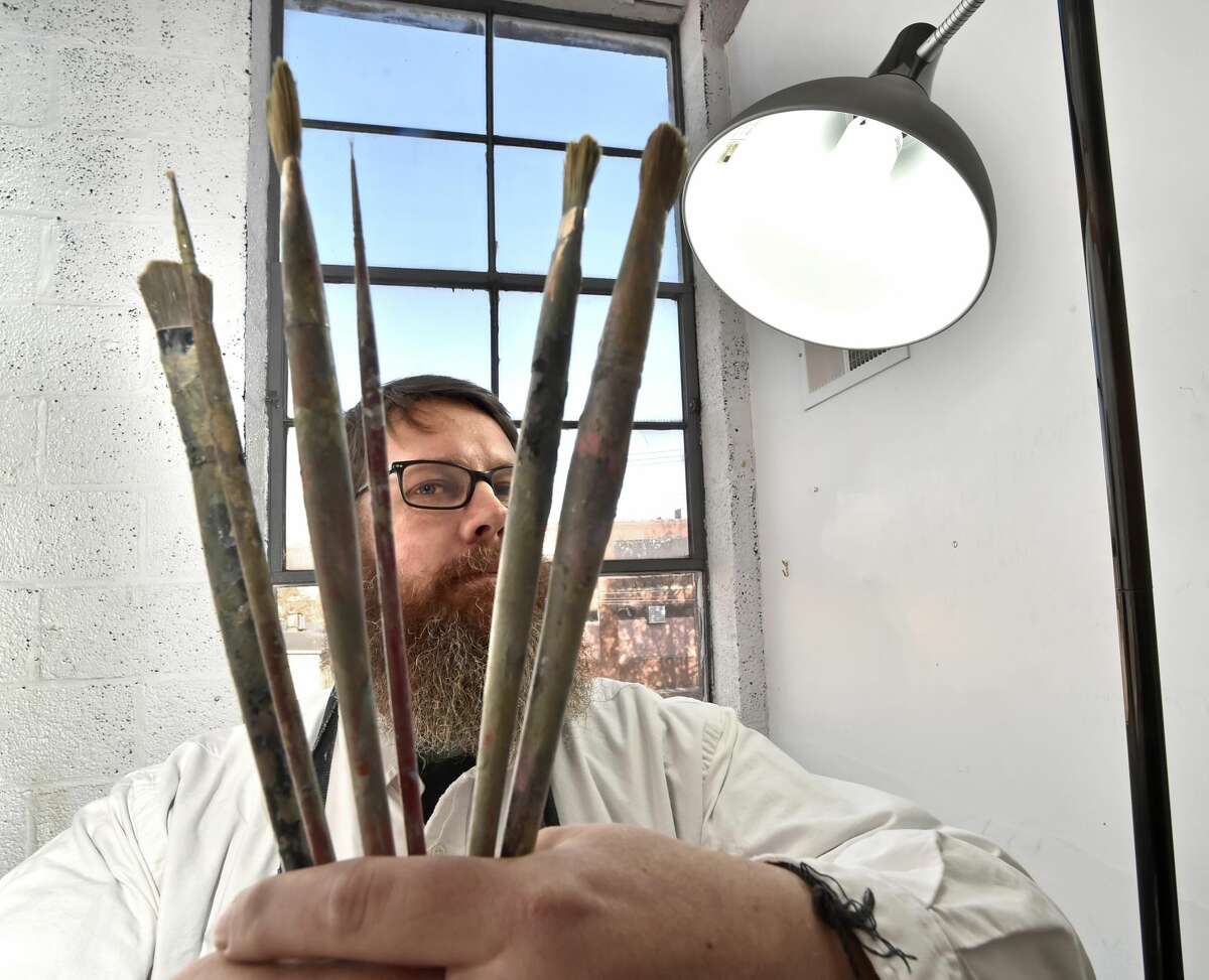 Artist Adam Chambers in his studio at the Erector Square Studios in New Haven. Chambers was commissioned to create ornaments for the National Christmas Tree at the White House this year to represent Connecticut.