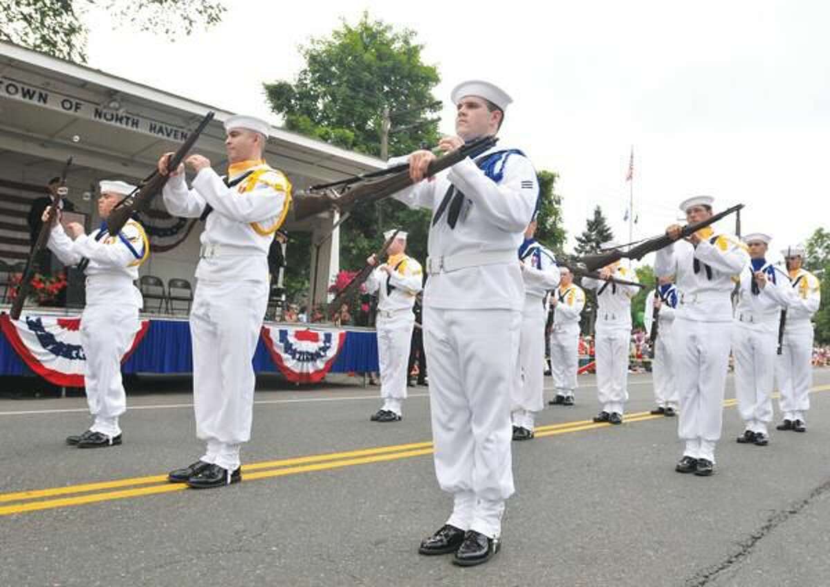 Photo by Brad Horrigan The Groton Naval Submarine School's Silver Dolphins Drill Team performs at Saturday's North Haven Memorial Day Parade.