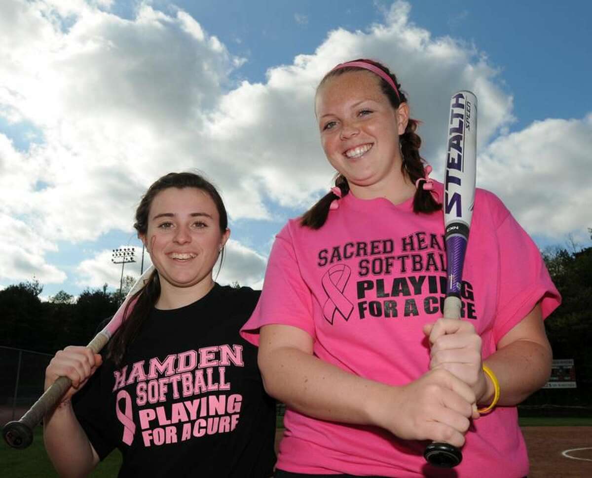 Photo by Mara Lavitt/Register Hamden's Colleen Murphy, left, and Sacred Heart Academy's Katie Winkle of Orange, right, organized a fundraiser to fight cancer for its softball game. Winkle had leukemia.