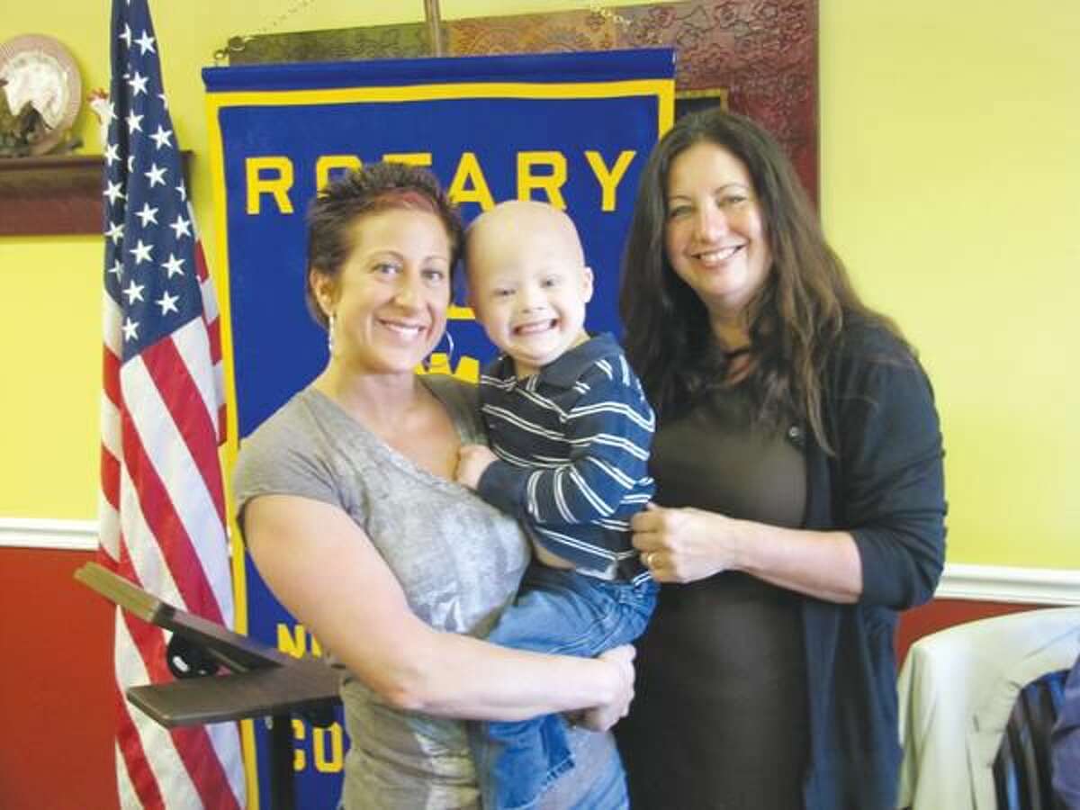 Photos courtesy of David Marchesseault, Rotary Secretary Past President of the North Haven Rotary Club, Theresa Viele, right, introduced Robin Raiano and her son, Logan, to the club last Tuesday at the Breakfast Nook Restaurant in North Haven.