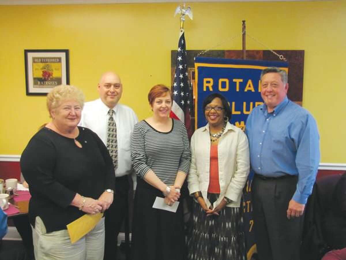Submitted photo by David Marchesseault, Rotary Secretary Jennifer Occhicone, left center, and Diane Calloway, right center, accepted a North Haven Rotary club check for Abby’s All Stars from Past President Nick Casella, right, as Mary Jane Mulligan and President Rick DiNorscia looked on.