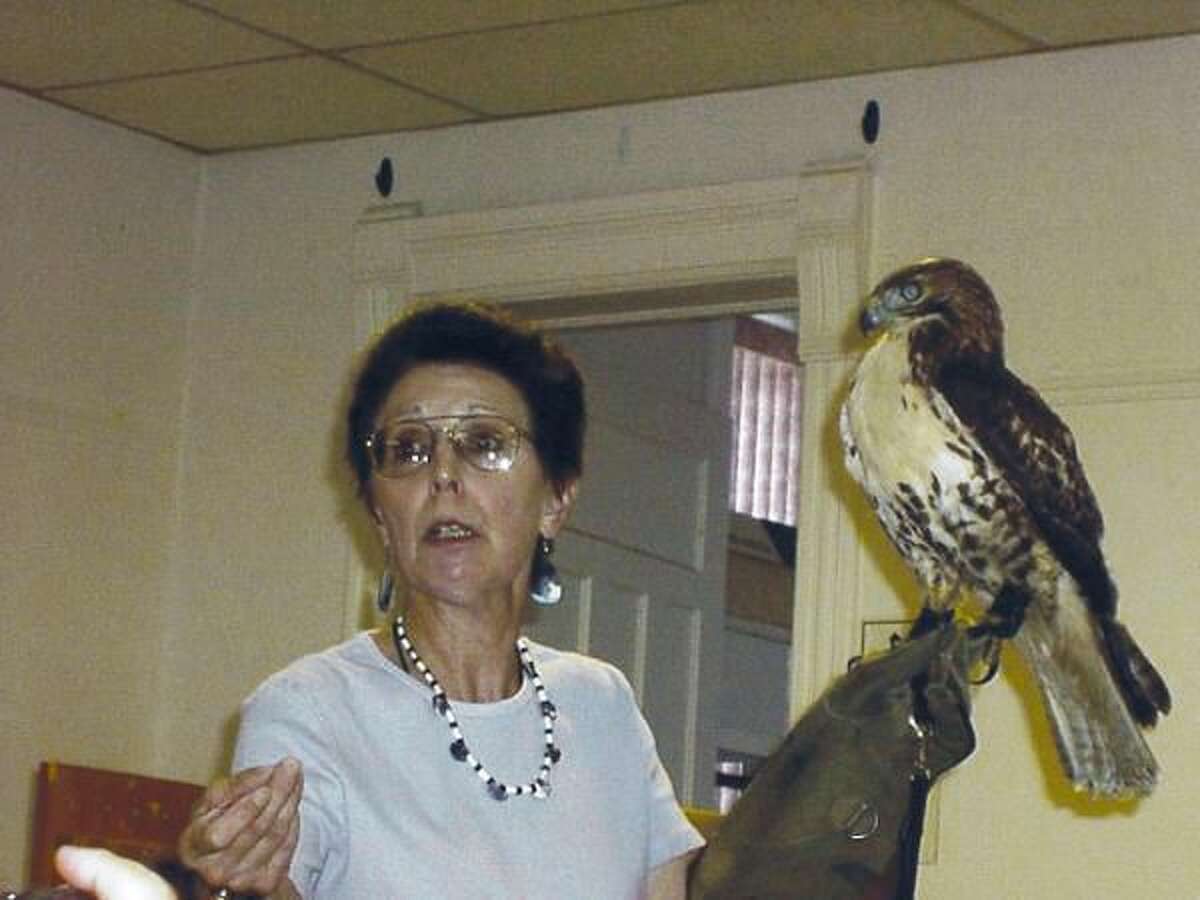 Submitted Photo Julie Anne Collier with Nipmunk, a Red-tailed hawk.