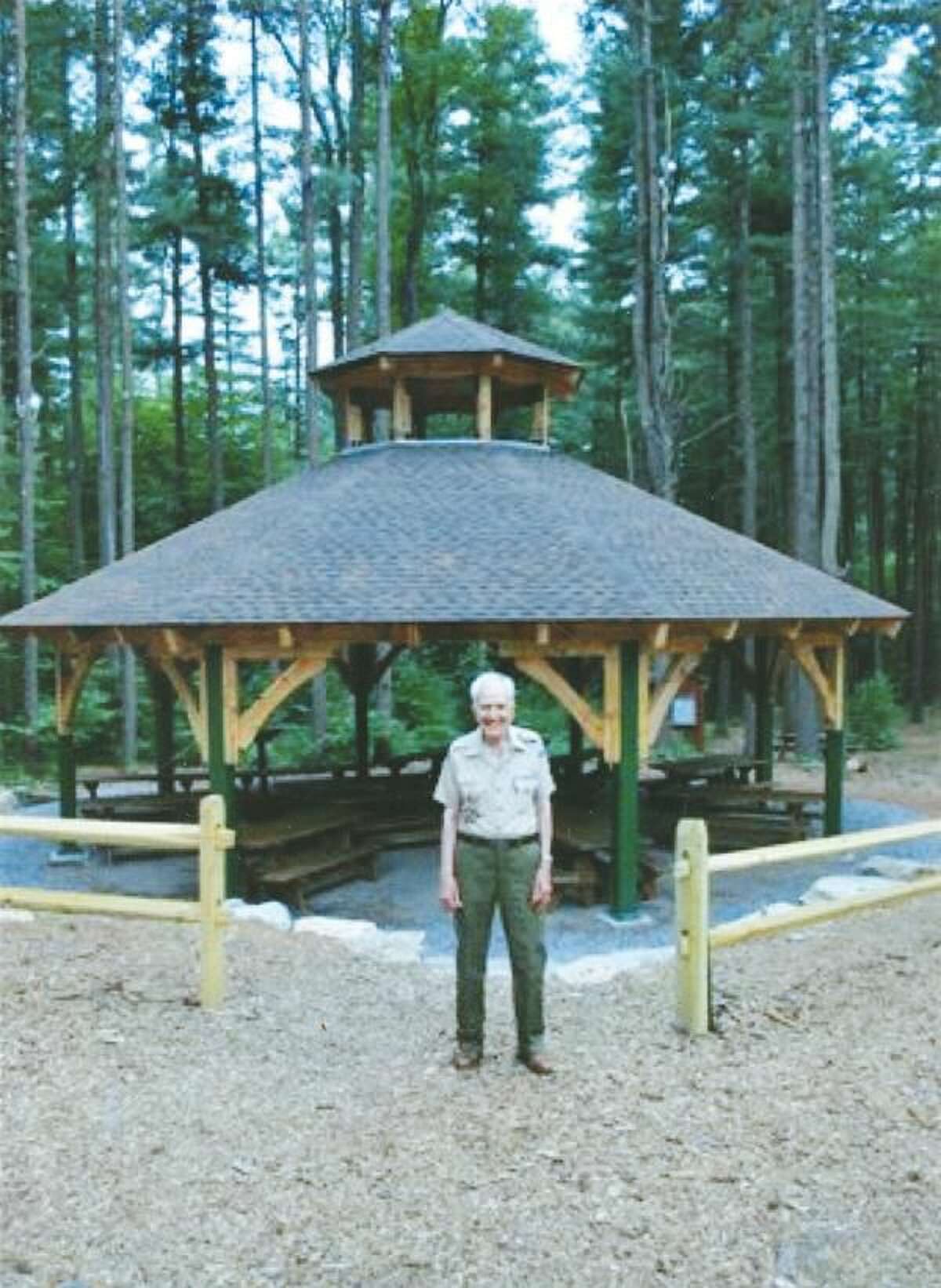 Submitted Photo Dr. Lawrence Pisani is shown in front of the pavilion named in his honor at the Connecticut Yankee Council’s boy Scout Camp Sequassen in New Hartford.