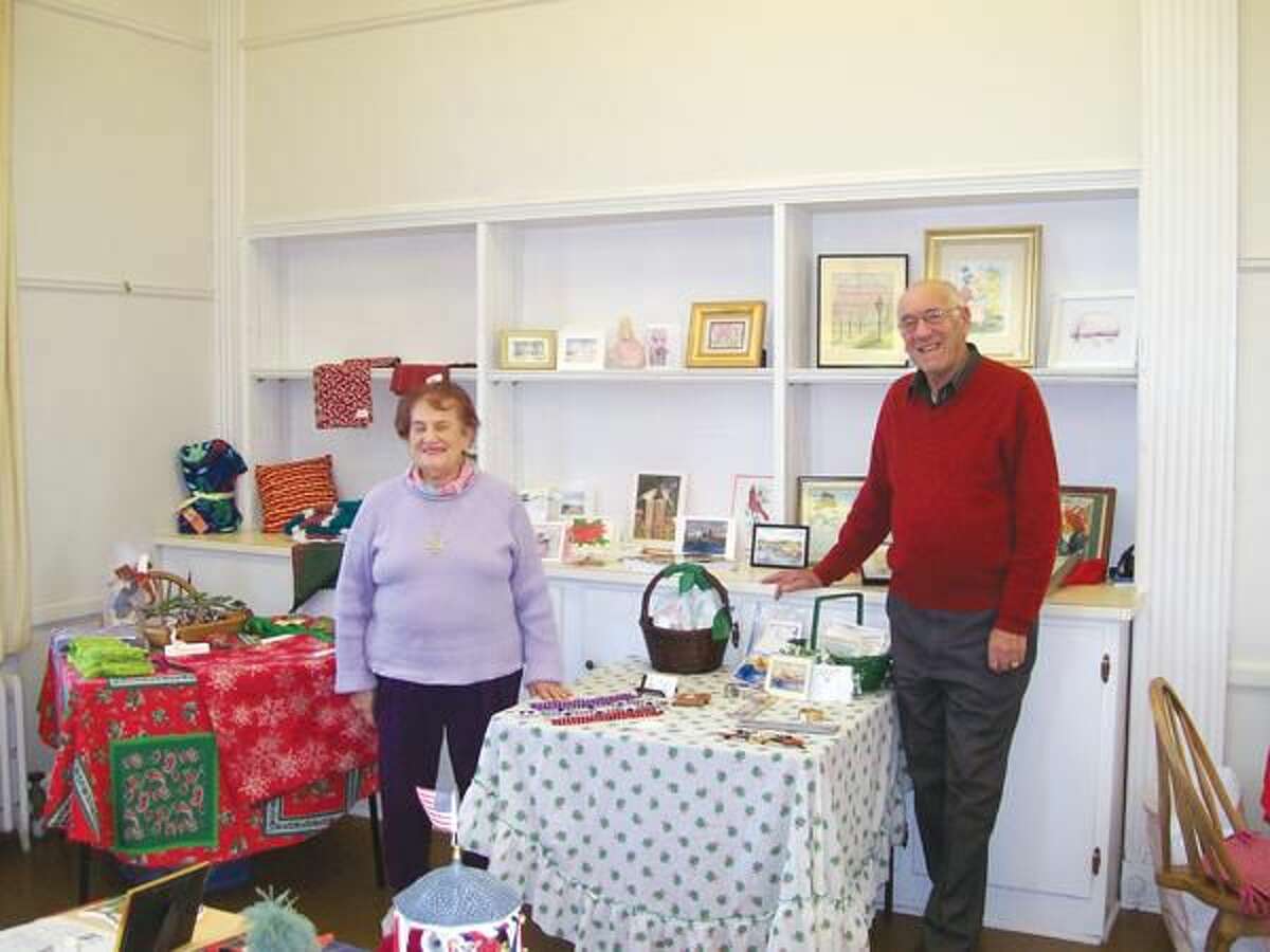 Photo by Lynn Fredricksen MaryLou and Joe Fiore showcase some of the one-of-a-kind items available at the North Haven Art Guild’s annual holiday sale.