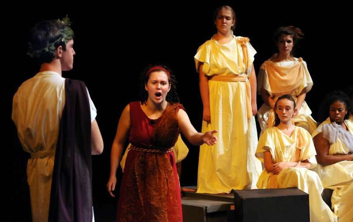 In the North Haven High School production of "Medea," Grace Kenny plays Medea and Myles Morkowski plays Jason, with the Greek Chorus behind them. Mara Lavitt/Register 11/2/11