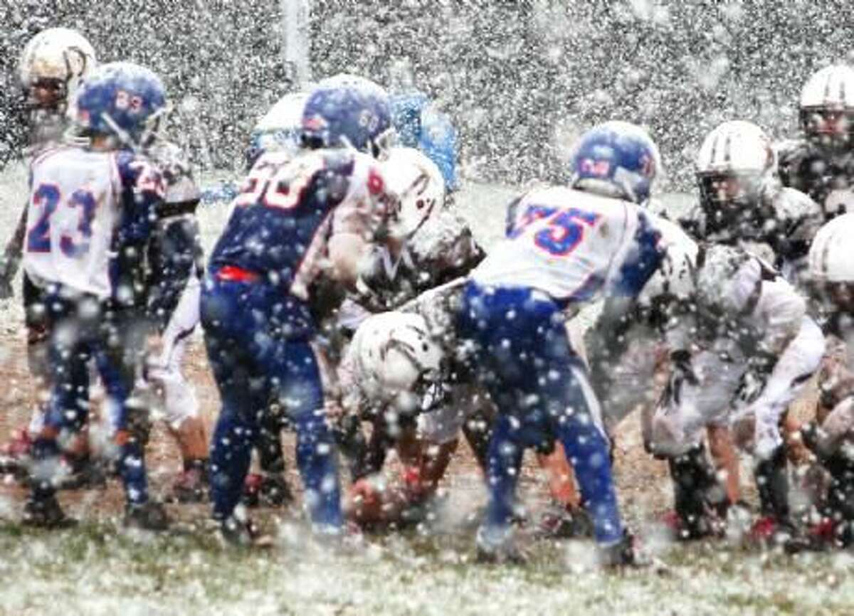 Photo courtesy of John Digregorio The North Haven fourth-grade B football team takes on Southington in the opening round of the playoffs in the snow.