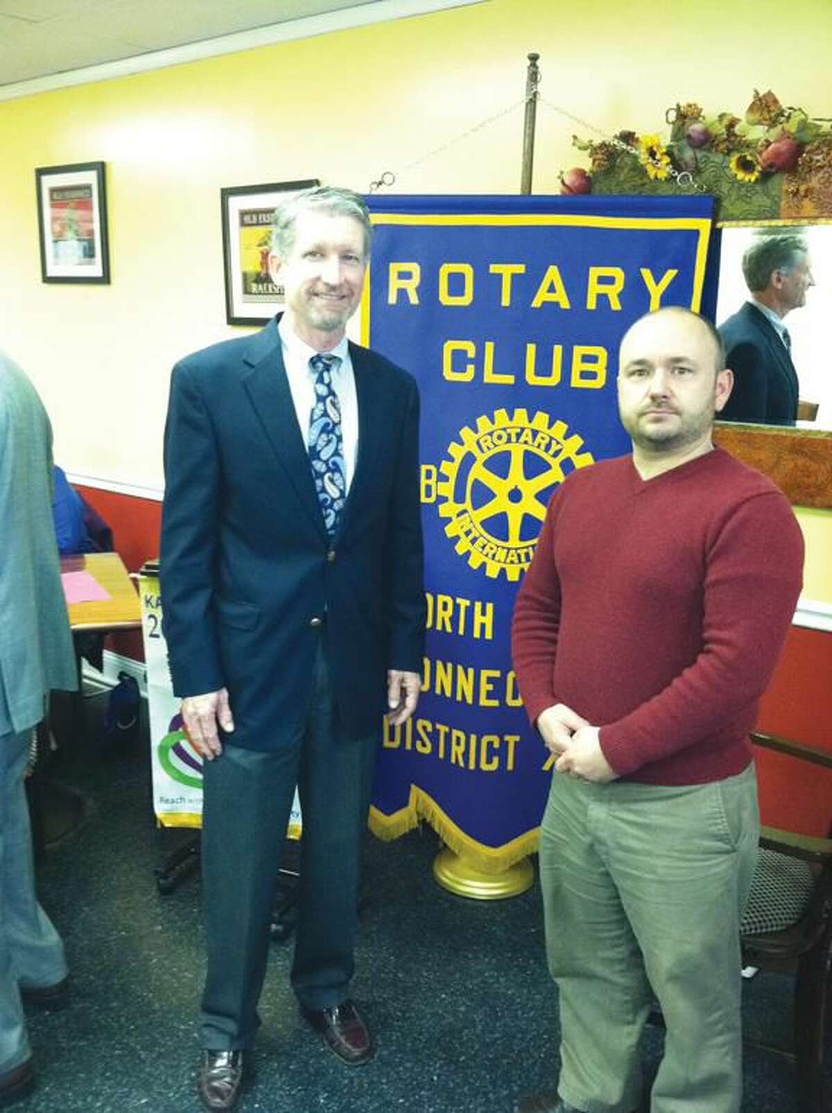Submitted photo by David Marchesseault, Rotary PR Chairman Dr. Grant Thomson, left, founder of Hands Help Inc., extends his personal thanks to Rotarian Jonathan Martinek, right, for his ongoing support.