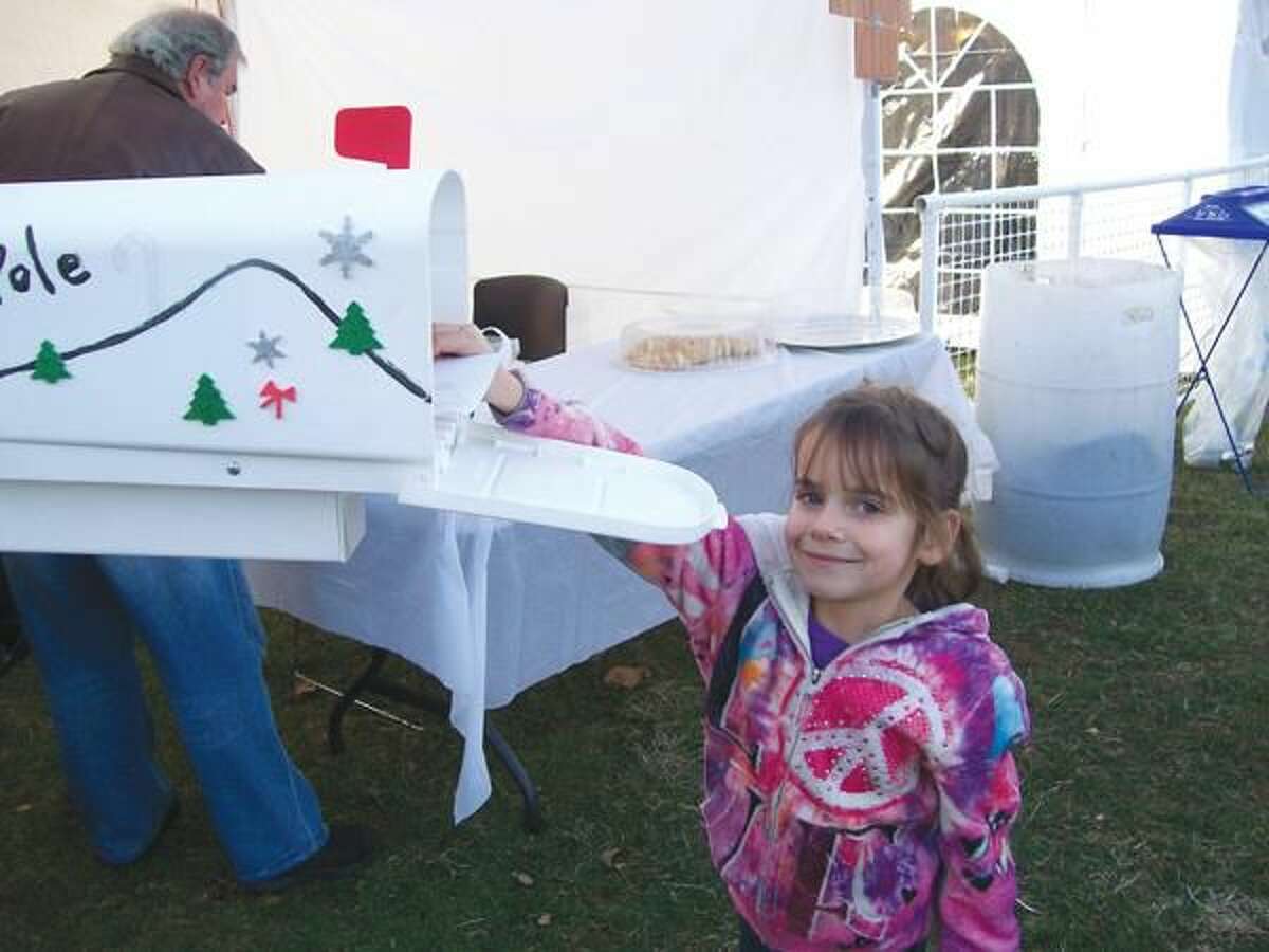 Photo by Lynn Fredricksen Madisen Karavas, 6, of North Haven, had a great time at the Silverbells Festival in Hamden Town Center Park recently. Like many of the other children, Madisen wrote a letter to Santa and sent it “special delivery” straight to the North Pole via the Hamden Arts Council’s mailbox.