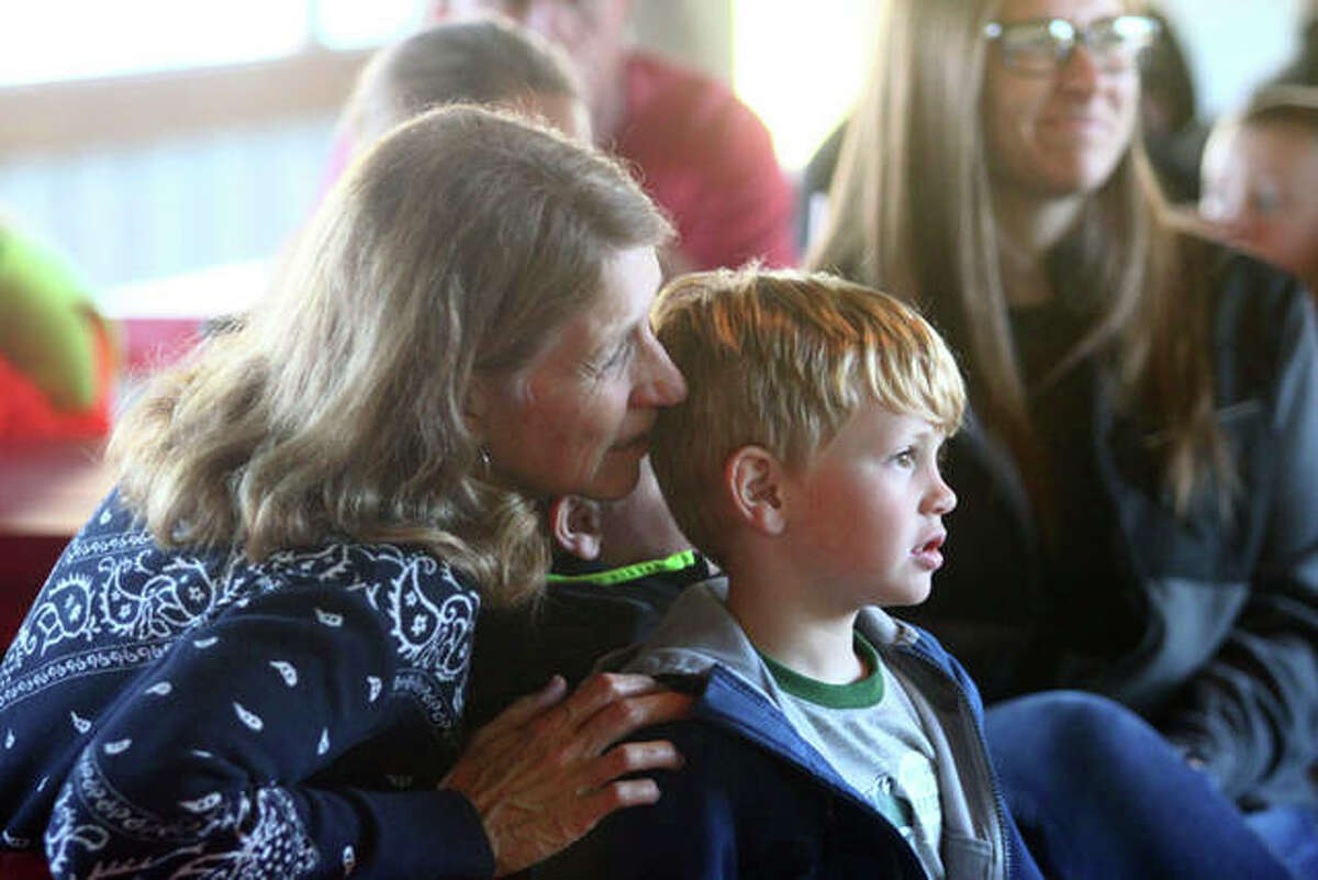 Susan Steckel and her grandson, Will Steckel, watch owls from TreeHouse Wildlife Center on Monday.