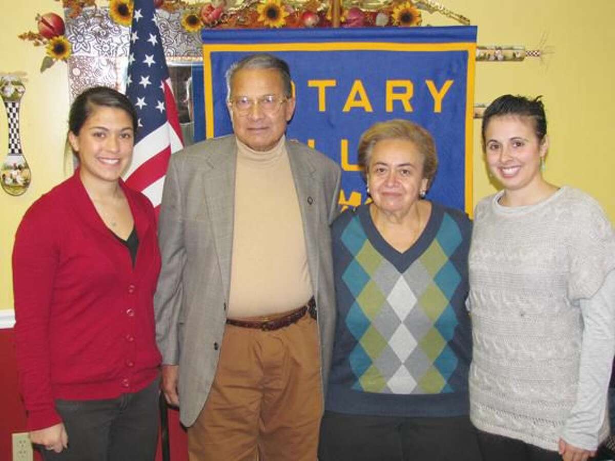 Submitted Photo by David Marchesseault, Rotary PR Chairman Rachel Hoffman, left, and Kayla Garriott, right, recently received the North Haven Rotary Foundation’s QU scholarship funds donated through Farooq & Eileen Khan, center, representing the Montowese Health & Rehabilitation Center.