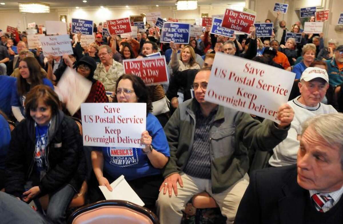 About 400 people, mostly postal workers, came out to a presentation made by the USPS about closing the Southern Connecticut Distribution and Processing Center in Wallingford. Mara Lavitt/Register