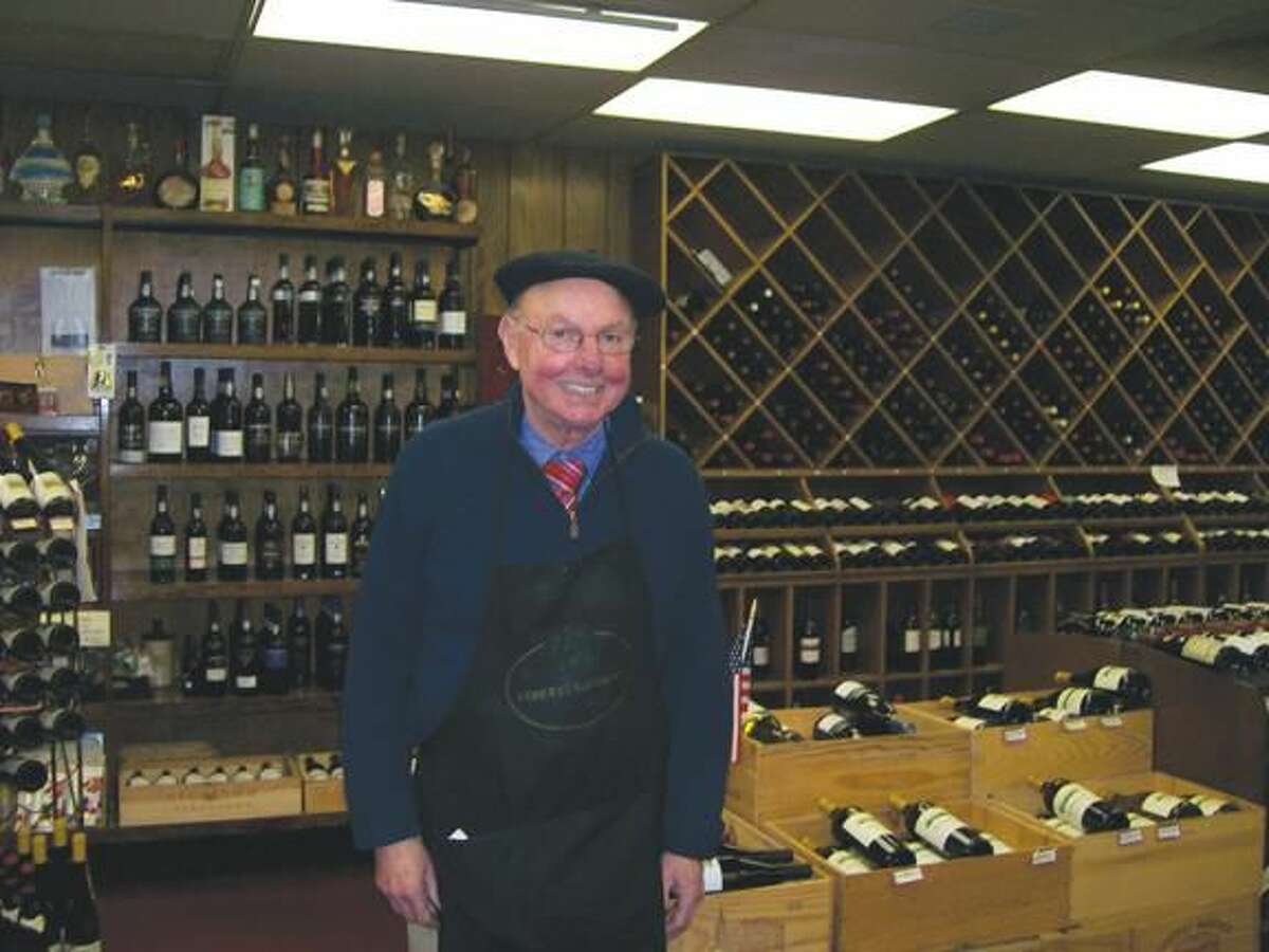 Photo by Lynn Fredrickson Bob Feinn, an owner at Mt. Carmel Wine and Spirit displays some of the wines he sells. Like several other liquor store owners in town, Feinn has joined forces with HYAC in its effort to prevent underage drinking.