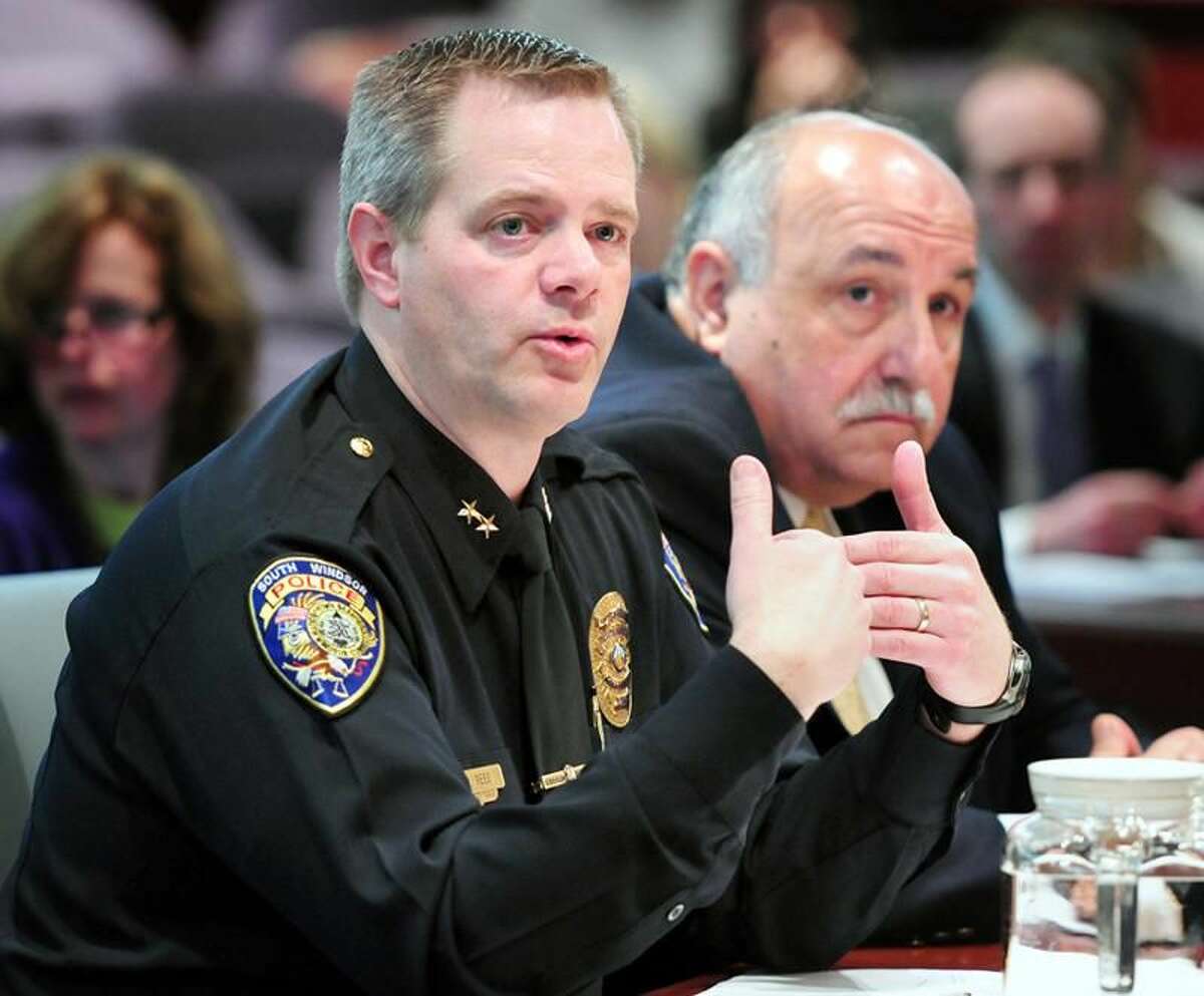 Police chiefs Matt Reed, left, of South Windsor and Anthony Salvatore, right, of Cromwell speak at a Judiciary Committee hearing concerning updating the Alvin W. Penn Racial Profiling Prohibition Act at the Legislative Office Building in Hartford. Arnold Gold/Register