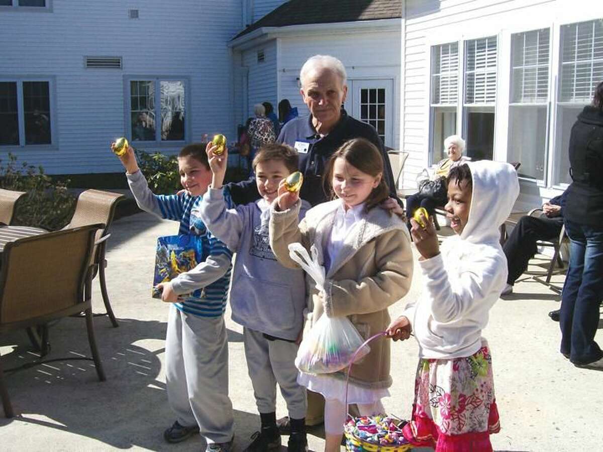 Photo by Lynn Fredricksen Left to right, Tristan Pappas, Andrew Carey, Lauren Ardolino and Aloni Cobb show off their gold eggs. Each child was awarded a special prize for finding a gold egg.