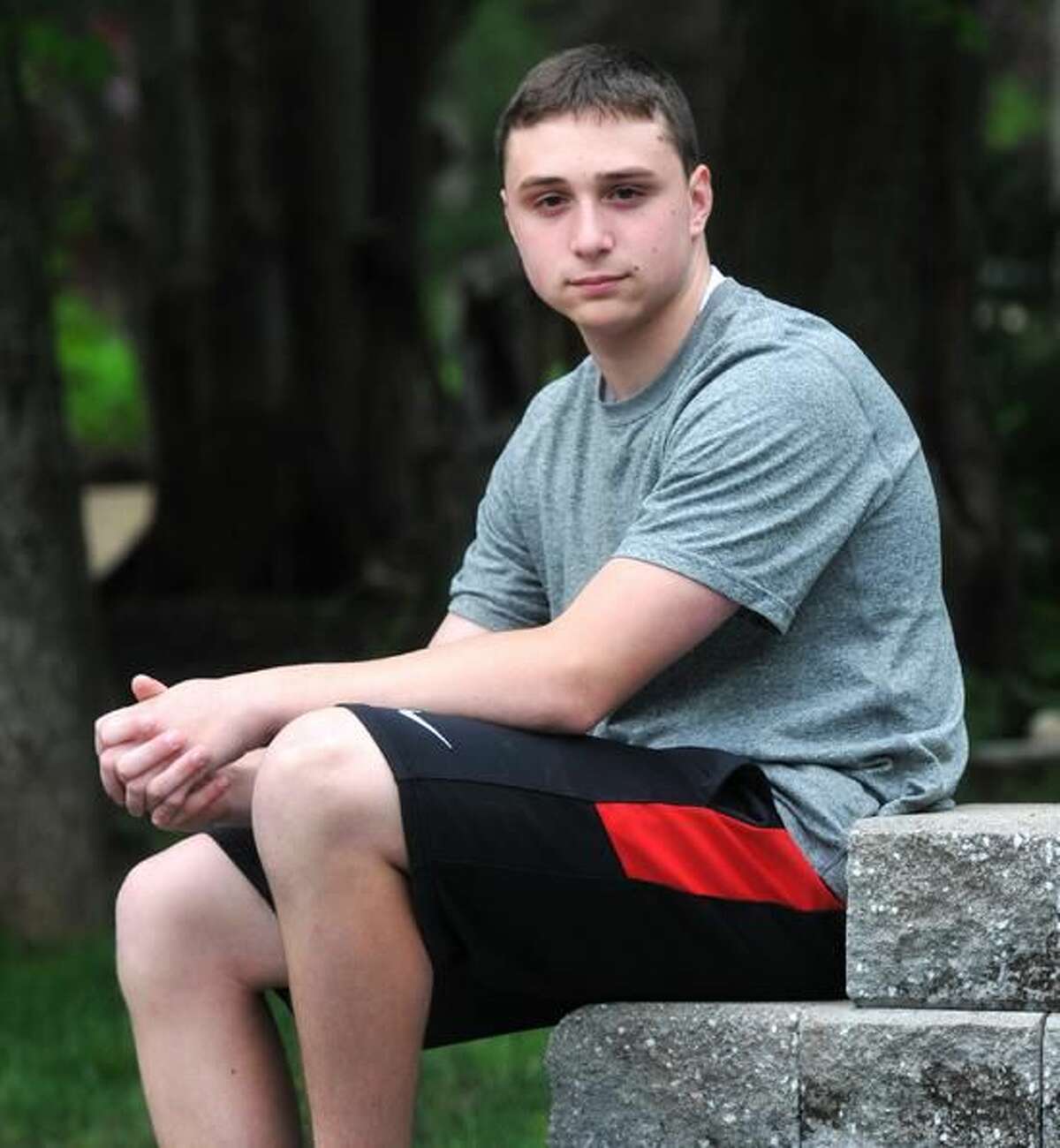 Cheshire—14-Year-old Zach Dubois of Cheshire helped save a man in his neighborhood who had badly injured himself with a chainsaw after he apparently fell off a stepladder. The man was unconscious when Dubois found him. Peter Casolino/New Haven Register 05/10/12
