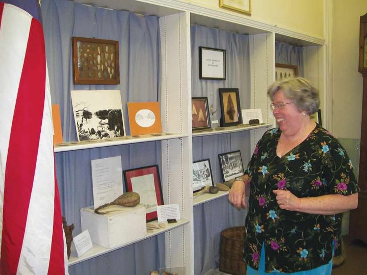 Photo by Lynn Fredricksen Susan Iverson, of the North Haven Historical Society, smiles as she gives a lesson during the Society’s Open House event held Saturday.