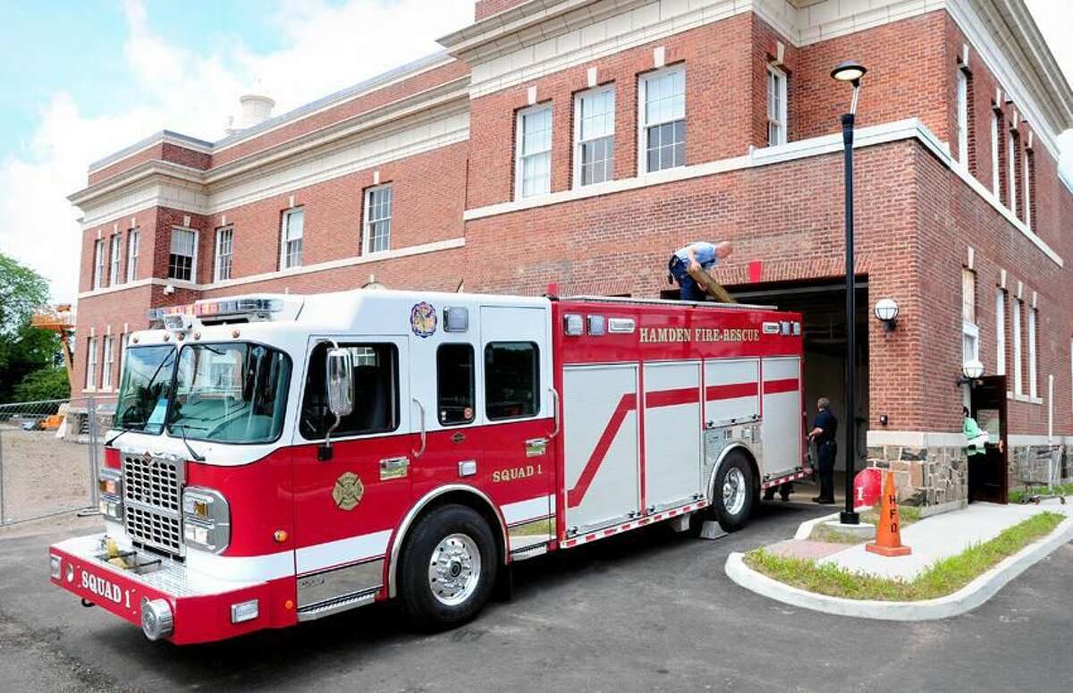 A firetruck enters the renovated fire station at Memorial Town Hall in Hamden for the first time on 6/18/2012. Photo by Arnold Gold/New Haven Register
