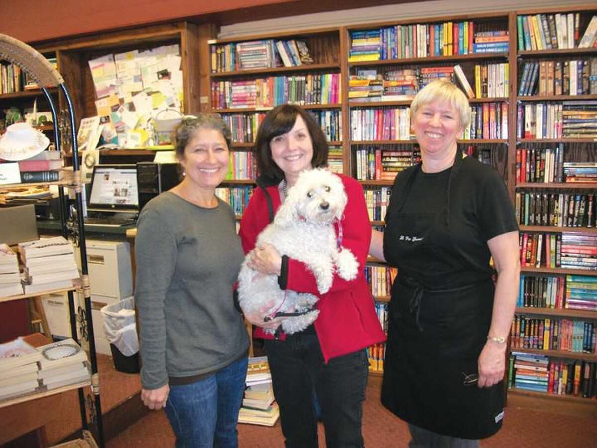Left to right: Teresa Fields, Linda Mooser, Susan Gooley and Lily the mini-poodle are a winning team running three businesses - Legal Grounds, Books & Co., and La Petit Gourmet, respectively.