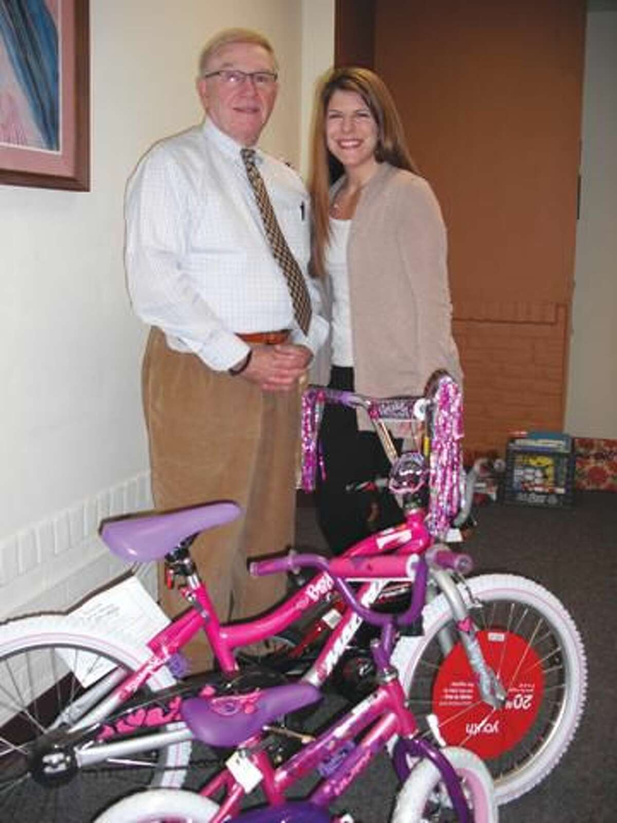 Submitted Photo Pictured are Danny Perrotto (Bikes for Babes) and Carla Riccio (Community Services).