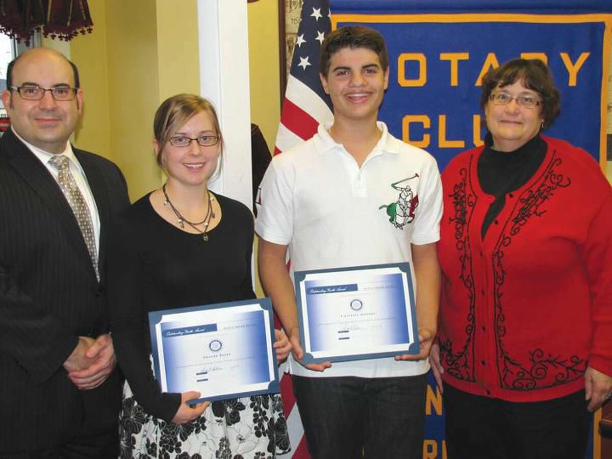 Submitted Photo North Haven High School Assistant Principal Andrew Pettola, left, congratulates Students of the Month Amanda Royka and Francesco Scarano, along with Rotary President Elect Debbie Volain.