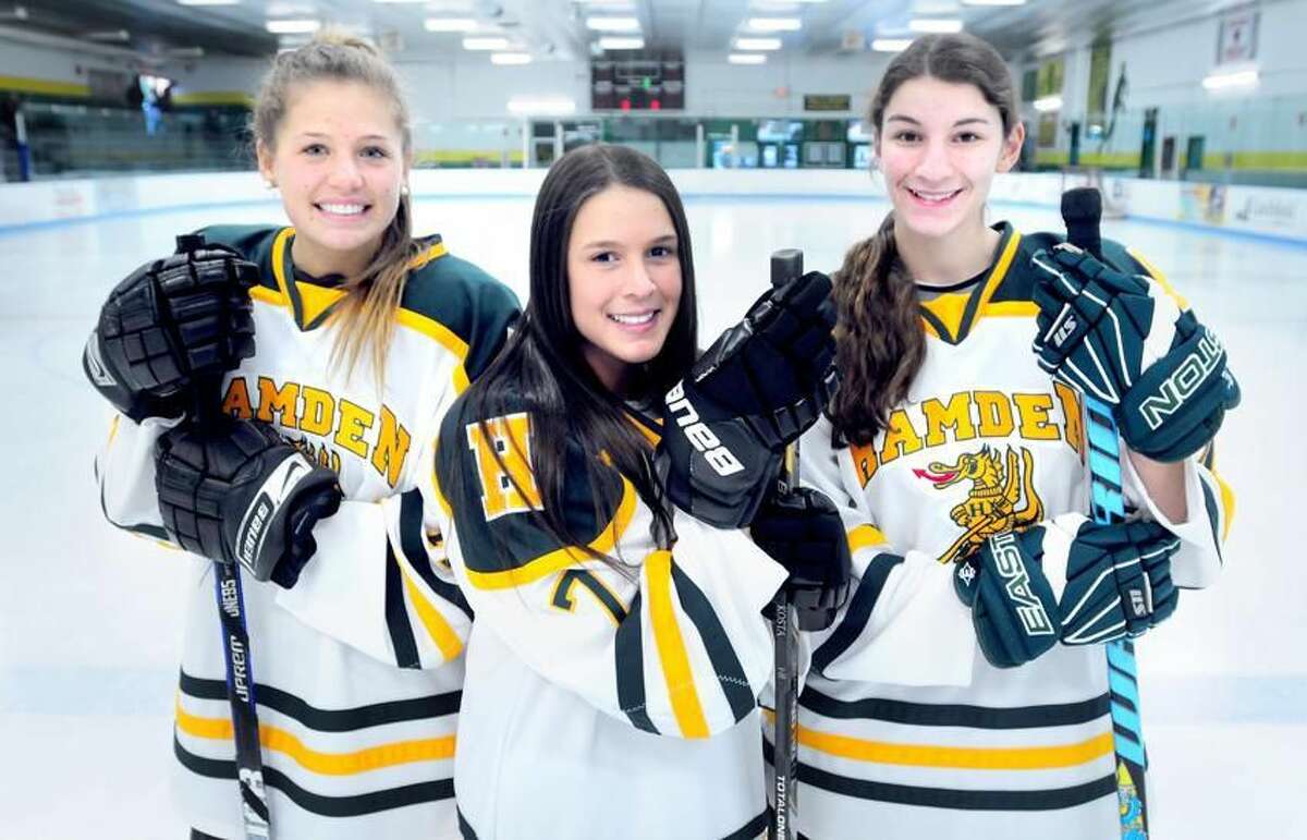 From left, Hamden hockey captains Rachel Ugolik, Nicki Pierne and Heather DelCervo at Astorino Rink in Hamden. (Arnold Gold/Register)