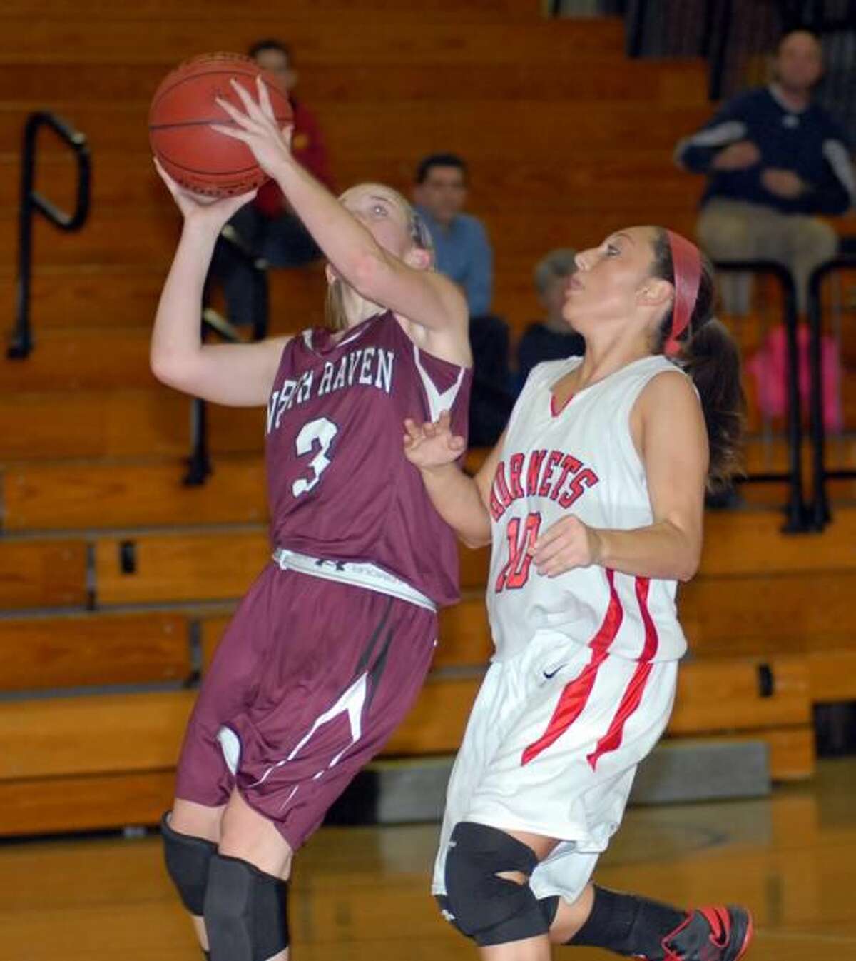Photo by Dave Phillips North Haven's Jill Johnson takes a shot against Branford.