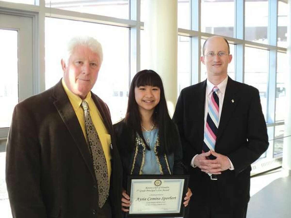 Submitted Photo The Hamden Rotary Club recognized two Hamden Middle School students for their outstanding contribution to the school community through their leadership, respectfulness, and ability to put others before themselves. Pictured with HMS Principal Dan Levy and Hamden Rotarian John Nolan is 7th Grader Aysia Comins-Sporbert.